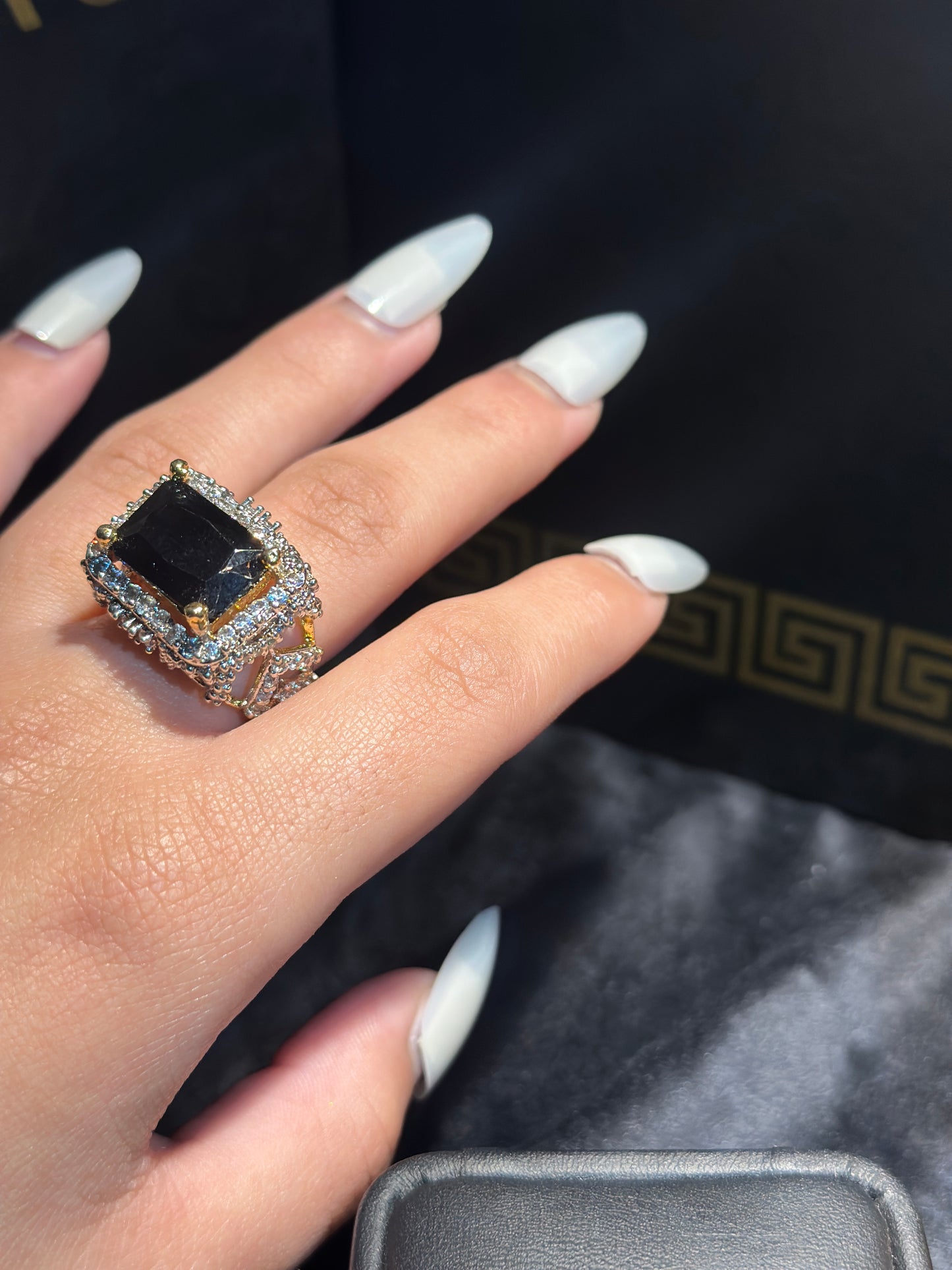 Emerald and black ring
